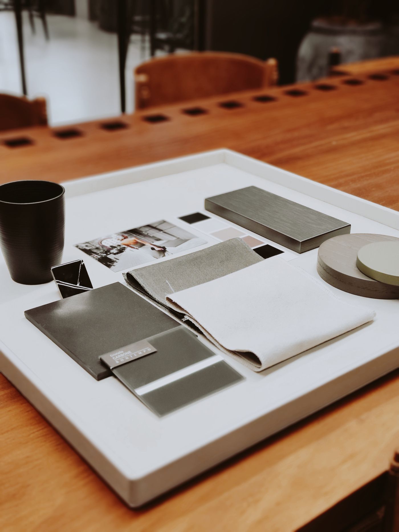 Textured fabric swatches arranged on an interior design sample tray